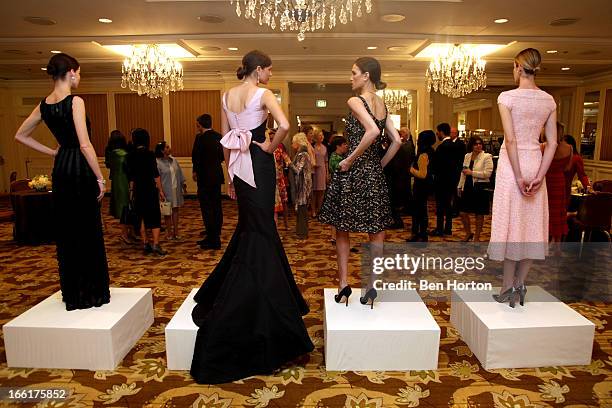 Michelle Box, Beth Ostendorf, Jenna Hurt, and Stacey Lobb model at The Colleagues' 25th annual spring luncheon honoring Wallis Annenberg at the...