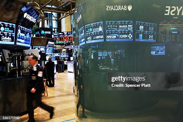 Traders work on the floor of the New York Stock Exchange on April 9, 2013 in New York City. The Dow Jones Industrial Average hit a new record trading...