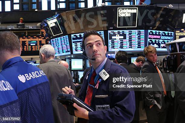 Traders work on the floor of the New York Stock Exchange on April 9, 2013 in New York City. The Dow Jones Industrial Average hit a new record trading...