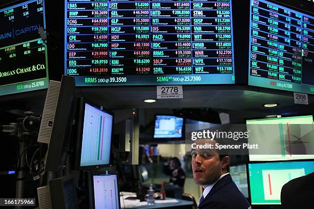 Traders work on the floor of the New York Stock Exchange on April 9, 2013 in New York City. The Dow Jones Industrial Average hit a new record trading...