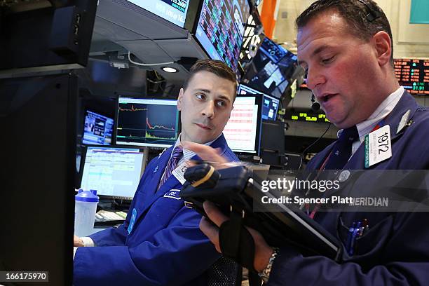 Traders work on the floor of the New York Stock Exchange on April 9, 2013 in New York City. The Dow Jones Industrial Average hit a new record trading...