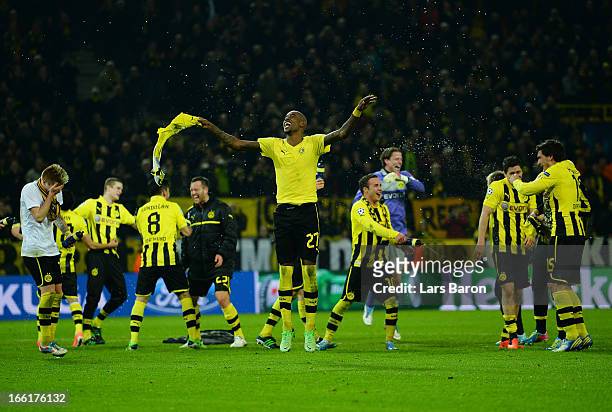 Felipe Santana of Borussia Dortmund celebrates victory and a place in the semi-finals with his tea mamtes during the UEFA Champions League...