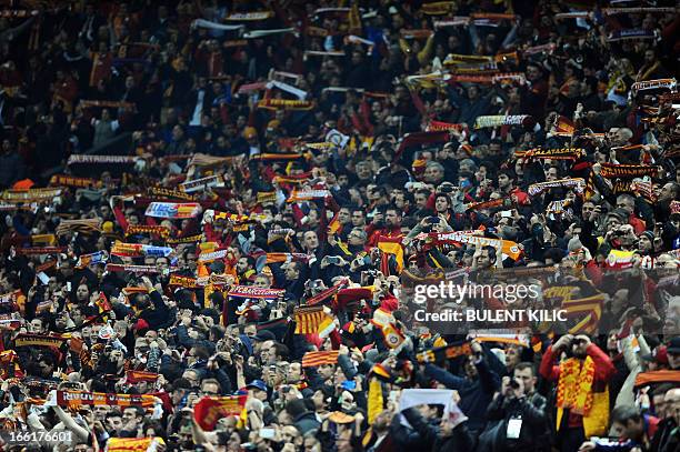 Fans of Galatasaray team cheer their players during the UEFA Champions League quarter-final second leg football match Galatasaray vs Real Madrid on...