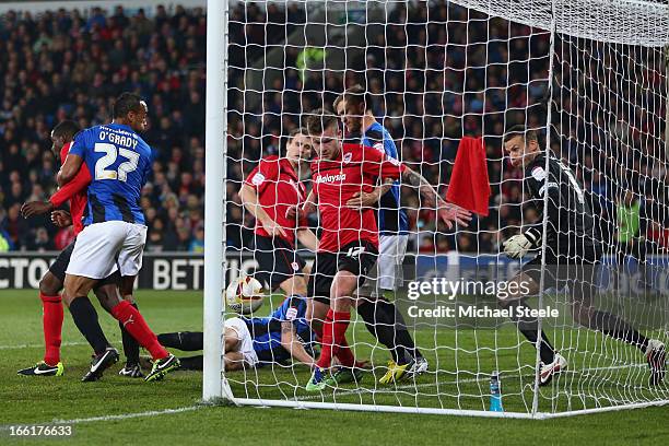 Aron Gunnarsson of Cardiff City watches the ball spin into the goal after Ben Turner of Cardiff City scores his sides opening goal during the npower...