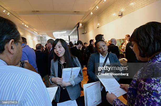 Job seekers speak with recruiters during the NYC Restaurant Job Expo at the Gabarron Foundation in New York, U.S., on Tuesday, April 9, 2013. The...