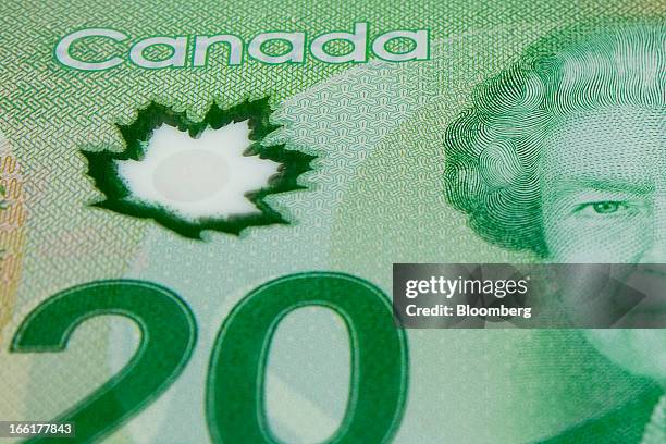 Queen Elizabeth II and the Norwegian maple leaf are seen on a Canadian twenty dollar bill arranged for a photograph in Toronto, Ontario, Canada, on...