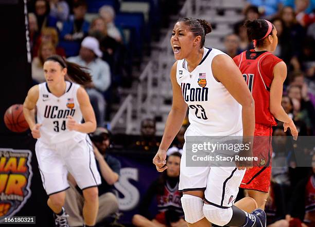 Kaleena Mosqueda-Lewis of the Connecticut Huskies celebrates after a play in the first half against the Louisville Cardinals during the 2013 NCAA...