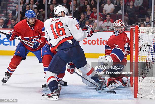 Carey Price of the Montreal Canadiens looks over his shoulder as the puck bounces in the net during the NHL game against the Washington Capitals on...