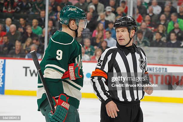 Mikko Koivu of the Minnesota Wild talks with Referee Stephen Walkom during the game against the Chicago Blackhawks on April 9, 2013 at the Xcel...