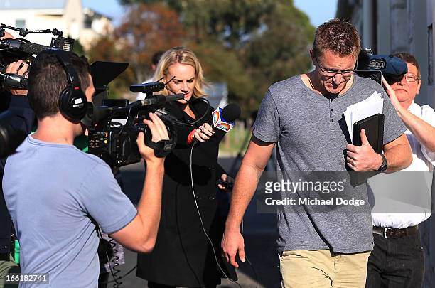 Demons coach Mark Neeld is seen walking away from a media reporter during a camp for Melbourne Demons AFL players and coaching staff at Sorrento on...