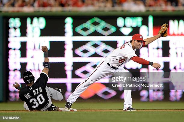 Alejandro De Aza of the Chicago White Sox is out at second base as Danny Espinosa of the Washington Nationals completes a double play in the fifth...