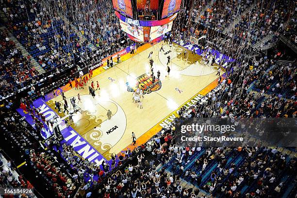 Confetti starts to fall as the Connecticut Huskies defeat the Louisville Cardinals during the 2013 NCAA Women's Final Four Championship at New...