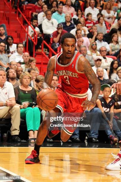 Brandon Jennings of the Milwaukee Bucks drives to the basket against the Miami Heat on April 9, 2013 at American Airlines Arena in Miami, Florida....