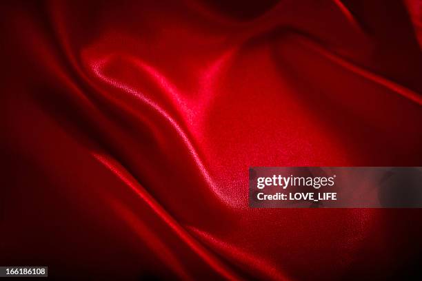 red satin background - red satin stock pictures, royalty-free photos & images