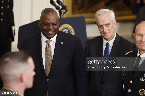 Secretary of Defense Lloyd Austin and Veterans Secretary Denis McDonough attend a ceremony where President Joe Biden awarded a Medal of Honor to...