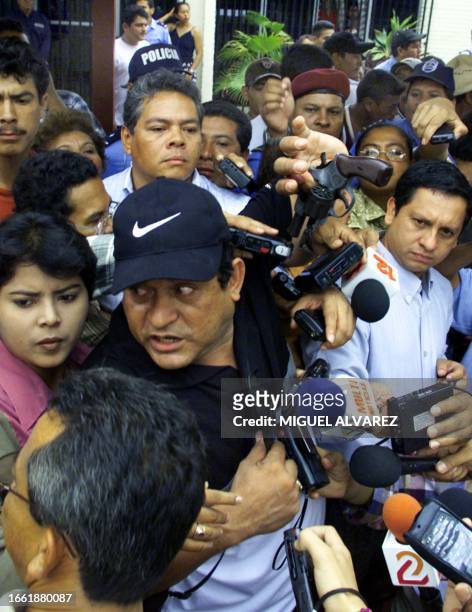 Mayor's office employee shows the gun with which he was threatened 06 April 2001 during a protest of the Liberal Party in Managua, Nicaragua. Un...