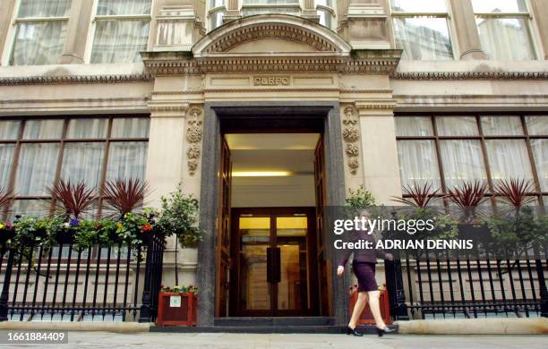 PowerGen employee leaves the registered corporate offices in London 09 April 2001. The electricity group is to be taken over by German firm Eon in a...