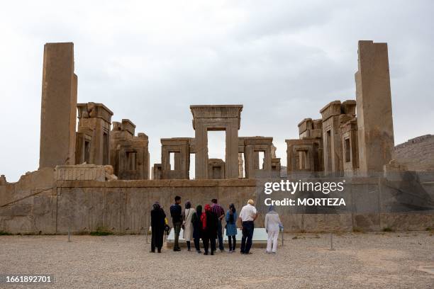 Fars, Iran. A view of the tourists in Persepolis. Persepolis was the ceremonial capital of the Achaemenid Empire.