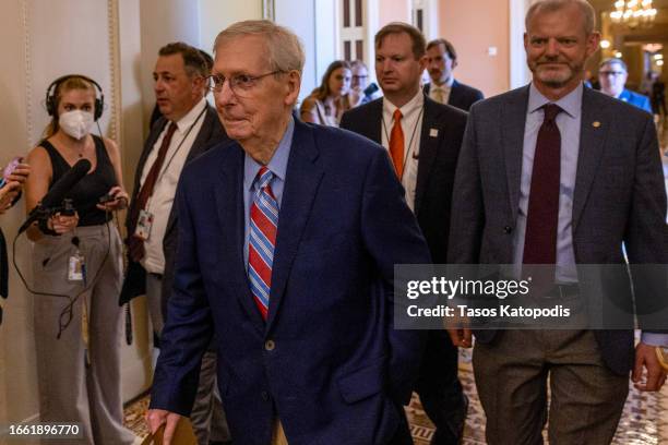 Senate Minority Leader Mitch McConnell walks to the Senate chamber to speak during the opening of the Senate at the US Capitol on September 05, 2023...