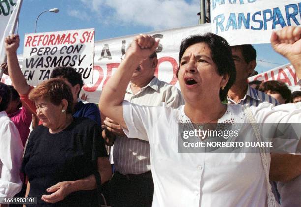 Woman shouts slogans against Paraguayan government during a demonstration of health care employees in Asuncion, Paraguay, 10 January 2001. The...