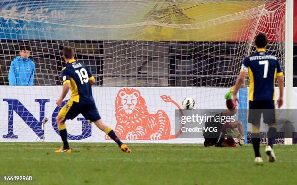 Mitchell Duke of Central Coast Mariners scores his team's first goal from a penalty spot during the AFC Champions League match between Guizhou Renhe...