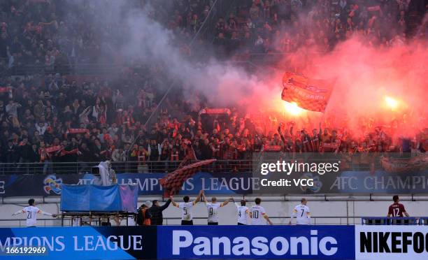 Guizhou Renhe fans cheer after the AFC Champions League match between Guizhou Renhe and Central Coast Mariners at Olympic Sports Center on April 9,...