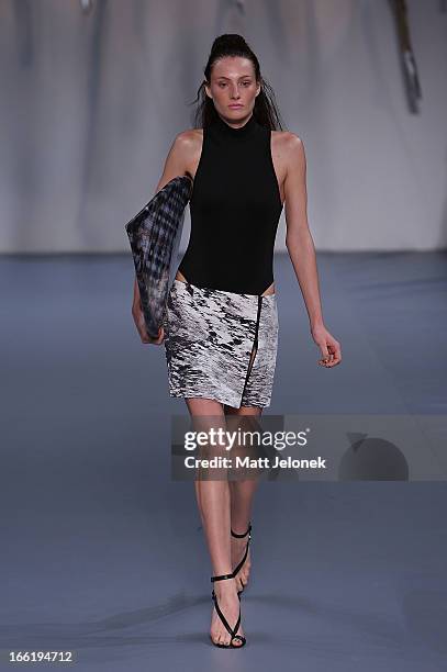 Model showcases designs by Watson X Watson on the runway at the Watson X Watson show during Mercedes-Benz Fashion Week Australia Spring/Summer...