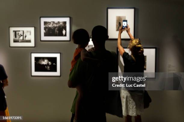 Visitors take pictures during the opening of the exhibition "Corps A Corps" Histoires De La Photographie Exhibition preview at Centre Pompidou on...