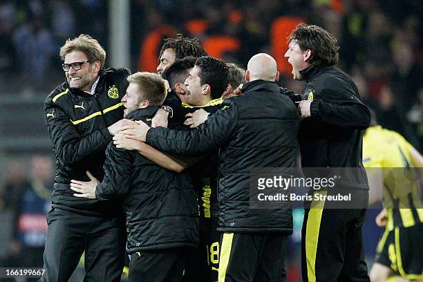 Head Coach Juergen Klopp of Borussia Dortmund celebrates victory with team mates after the UEFA Champions League quarter-final second leg match...