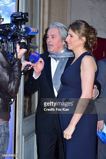 Alain Delon and Maud Fontenoy attend the Maud Fontenoy Foundation - Annual Gala Arrivals at Hotel de la Marine on April 9, 2013 in Paris, France.