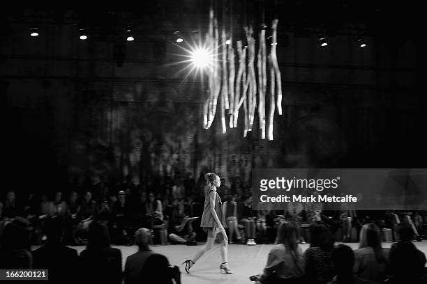 Model showcases designs on the runway at the Watson X Watson show during Mercedes-Benz Fashion Week Australia Spring/Summer 2013/14 at Carriageworks...