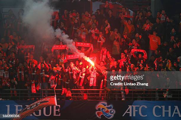 Guizhou Renhe fans support their team during the AFC Champions League match between Guizhou Renhe and Central Coast Mariners at Olympic Sports Center...