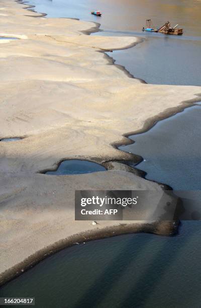 This picture taken on April 9, 2013 shows the riverbed of the Hanjiang River during its dry season in Shiyan, central China's Hubei province. China's...