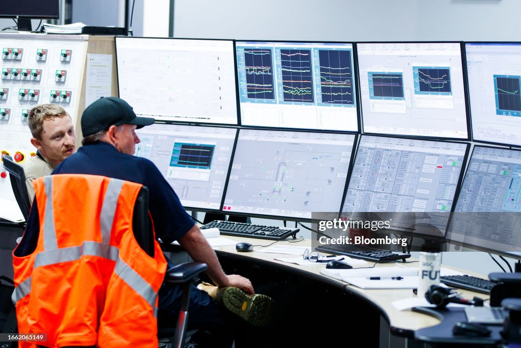 Shell Control Building Workers inside the Main Control Room at Shell's Queensland Curtis LNG ...