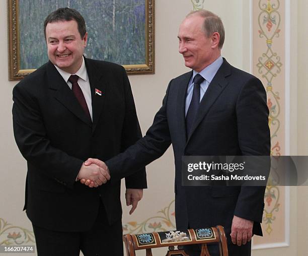 Serbian Prime Minister Ivica Dacic greets Russian President Vladimir Putin during a meeting on April 10, 2013 in Moscow, Russia. The two leaders met...