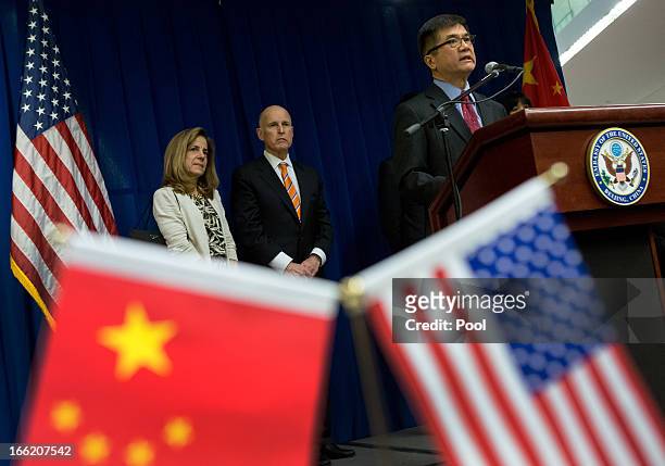 Ambassador to China Gary Locke delivers his speech on stage as California Governor Jerry Brown and the Govenor's wife Anne Brown look on during a...