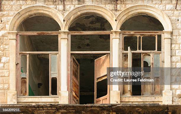 abandoned building featuring arched windows - haifa bildbanksfoton och bilder