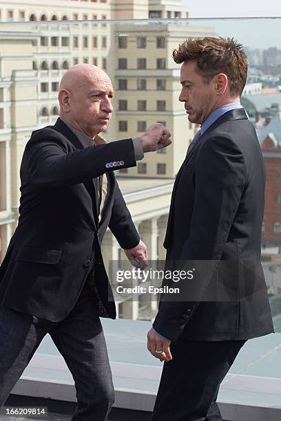 Actors Robert Downey Jr. And Sir Ben Kingsley attend a photocall on the roof of The Ritz Carlton hotel during the Russia Tour for Iron Man 3 on April...