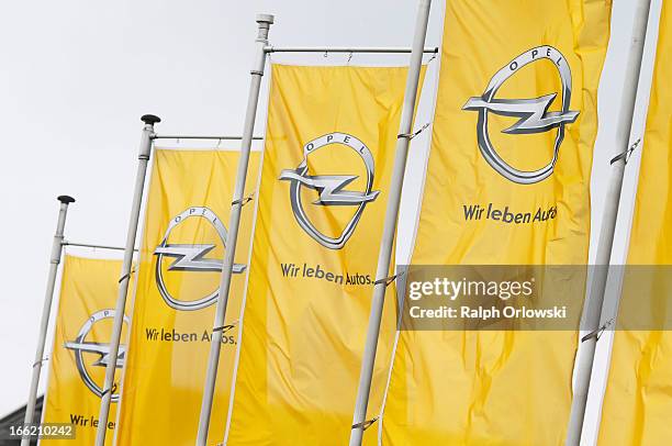 Opel flags flatter in the wind at the headquarters of German carmaker before a press conference on April 10, 2013 in Ruesselsheim, Germany. German...