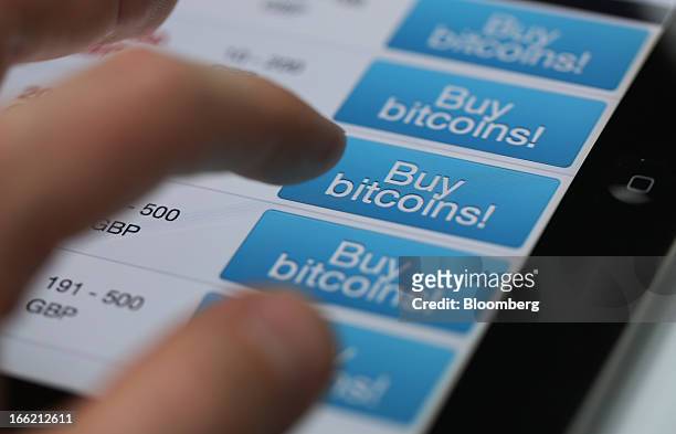 User prepares to purchase an amount of Bitcoin currency for sale on an internet website in this arranged photograph in London, U.K., on Wednesday,...