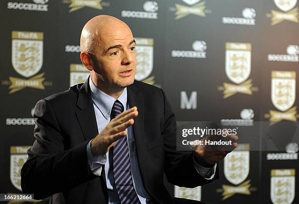 In this handout image provided by The FA, UEFA general secretary Gianni Infantino speaks to the media in the FA150 lounge during the Soccerex...
