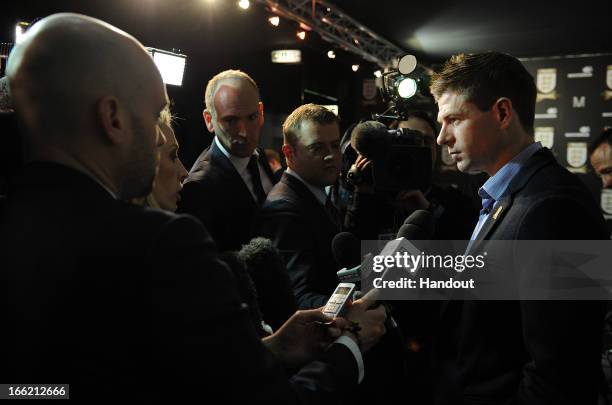 In this handout image provided by The FA, Steven Gerrard speaks to the media in the FA150 lounge during the Soccerex European Forum Conference...