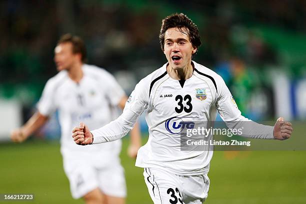 Oleg Zoteev of Bunyodkor celebrates his team's first goal by team mate Fozil Musaev during the AFC Champions League Group match between Bunyodkor and...