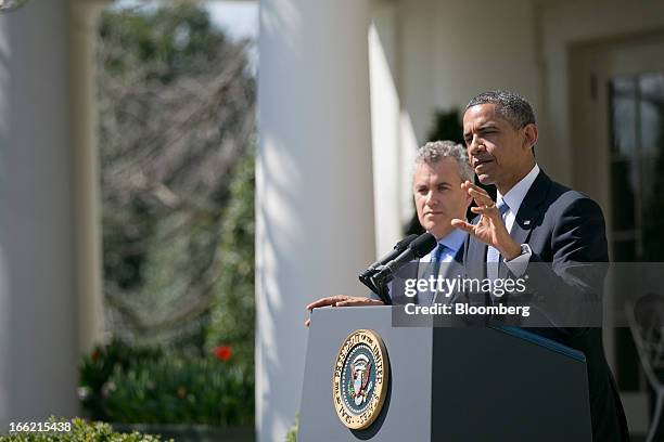 President Barack Obama, right, speaks in the Rose Garden of the White House with Jeffrey Zients, acting director of the Office of Management and...