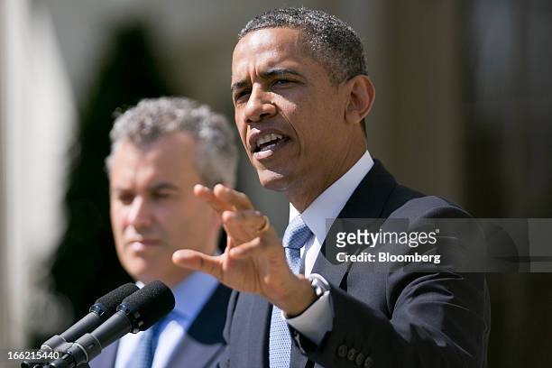 President Barack Obama, right, speaks in the Rose Garden of the White House with Jeffrey Zients, acting director of the Office of Management and...