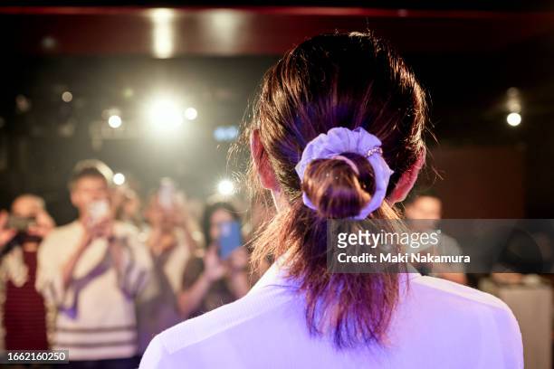 audience members take pictures with their mobile devices during the female presenter's businesska speech. - health motivational quotes stock pictures, royalty-free photos & images