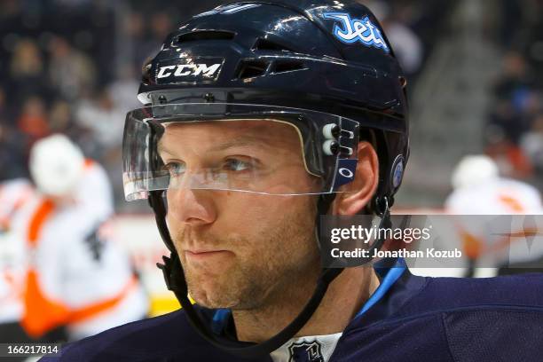 Aaron Gagnon of the Winnipeg Jets looks on during the pre-game warm up prior to NHL action against the Philadelphia Flyers at the MTS Centre on April...