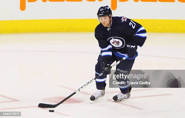 Aaron Gagnon of the Winnipeg Jets carries the puck up the ice during first period action against the Philadelphia Flyers at the MTS Centre on April...