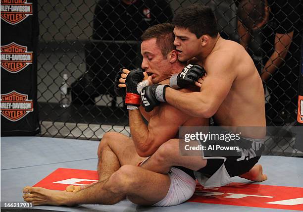 Kelvin Gastelum secures a rear choke submission against Josh Samman in their semifinal fight during filming for season seventeen of The Ultimate...