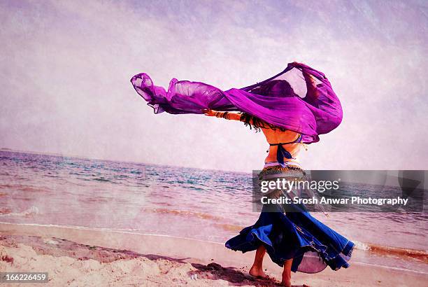 belly dancing at the beach - belly dancer stock pictures, royalty-free photos & images